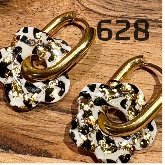 Quaste, Leopard und Gold